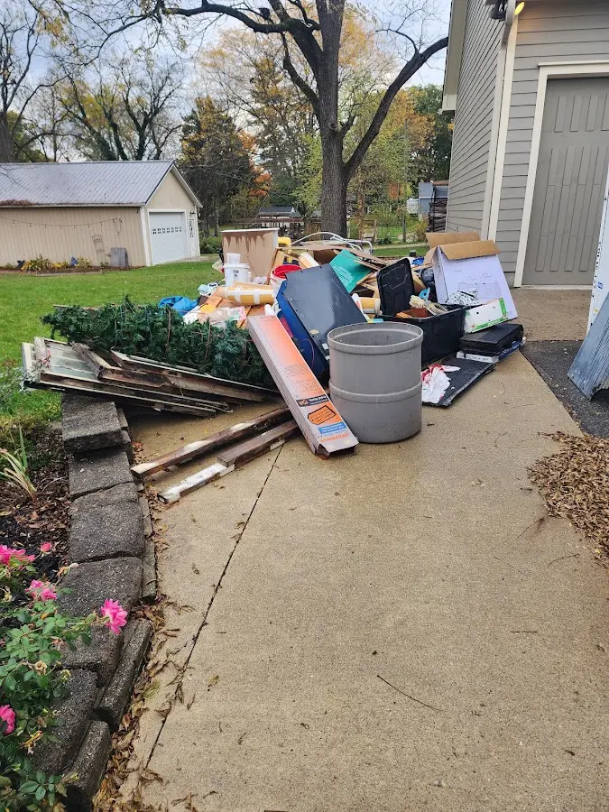 Dumpster being loaded with debris for 30 Yard Dumpster Rental in Lunenburg